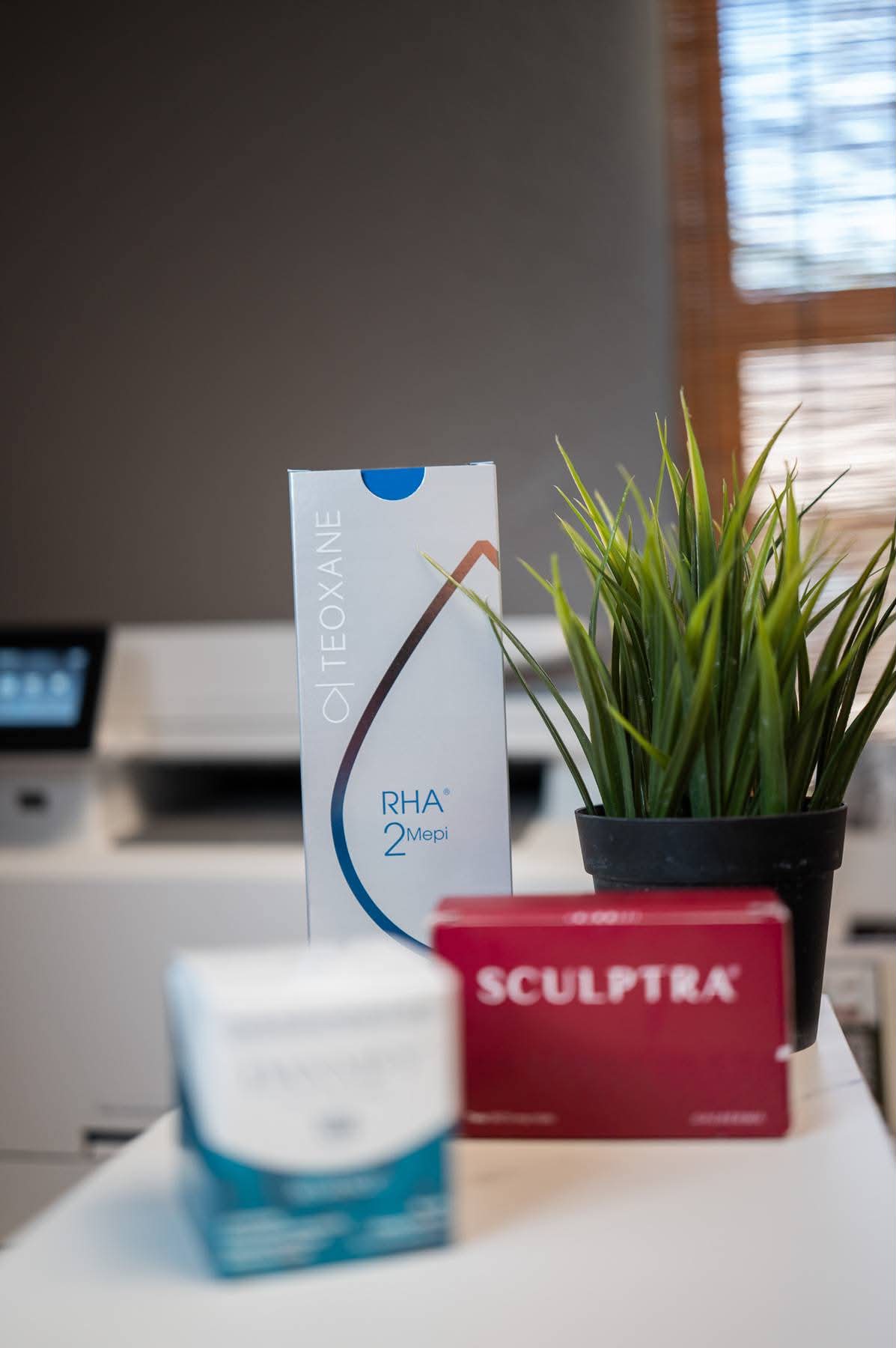 Teoxane RHA and Sculptra on display